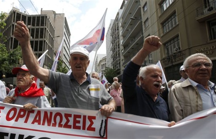 Pensioners chant slogans during a march organized by a Communist-backed labor union in central Athens Thursday.